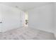 Spacious bedroom featuring an open doorway leading into the upstairs hallway and soft grey carpeting at 172 Eagleston Ln, Sarasota, FL 34240