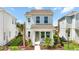 Charming two-story home featuring manicured landscaping, inviting entrance, and a welcoming facade at 172 Eagleston Ln, Sarasota, FL 34240