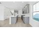 Bright kitchen with stainless steel appliances, subway tile backsplash, and center island at 172 Eagleston Ln, Sarasota, FL 34240