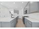 Spacious kitchen featuring gray cabinetry, a large center island, and stainless steel appliances at 172 Eagleston Ln, Sarasota, FL 34240