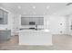 Open kitchen featuring a large island, modern gray cabinets, and recessed lighting at 172 Eagleston Ln, Sarasota, FL 34240