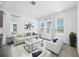 Bright living room features stylish furniture, neutral colors, and great natural light at 172 Eagleston Ln, Sarasota, FL 34240