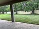 Spacious backyard features a well-maintained lawn and mature trees at 19575 Fort King Run, Brooksville, FL 34601