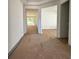 Bright hallway with large windows at the end, prepped for flooring installation at 19575 Fort King Run, Brooksville, FL 34601