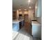 Modern kitchen with stainless steel appliances, large island, and light gray cabinets at 19575 Fort King Run, Brooksville, FL 34601