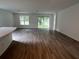 Bright living room with wood flooring, windows with view to the exterior at 19575 Fort King Run, Brooksville, FL 34601
