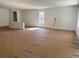 Open living space with natural light, ready for finishing touches and flooring installation at 19575 Fort King Run, Brooksville, FL 34601