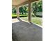 Covered patio area with ample space for outdoor entertaining, overlooking a green lawn at 19575 Fort King Run, Brooksville, FL 34601