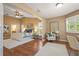 Spacious main bedroom with hardwood floors, sitting area, and ensuite bath with neutral walls at 2072 Misty Sunrise Trl, Sarasota, FL 34240