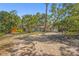 Charming single-story home with a welcoming brick driveway and lush, mature landscaping at 2072 Misty Sunrise Trl, Sarasota, FL 34240