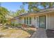 Welcoming home exterior featuring well-maintained landscaping and a brick paver walkway at 2072 Misty Sunrise Trl, Sarasota, FL 34240