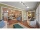 Open-concept living area with hardwood floors and lots of natural light at 2072 Misty Sunrise Trl, Sarasota, FL 34240