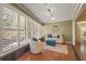 Cozy living space with plantation shutters, comfortable seating, and stylish decor at 2072 Misty Sunrise Trl, Sarasota, FL 34240