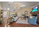 Inviting living room with vaulted ceilings, modern lighting, and comfortable seating at 2072 Misty Sunrise Trl, Sarasota, FL 34240