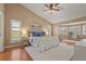 Spacious main bedroom featuring vaulted ceilings, plantation shutters, and access to an office space at 2072 Misty Sunrise Trl, Sarasota, FL 34240