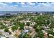 Stunning aerial view of a charming home nestled in a lush, green neighborhood with city views in the distance at 2120 8Th W Ave, Bradenton, FL 34205