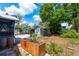 View of the backyard featuring a storage shed, concrete patio, and planter box at 2120 8Th W Ave, Bradenton, FL 34205
