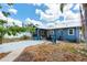 A backyard showing a concrete patio, shade, and screened porch, creating a relaxing outdoor retreat at 2120 8Th W Ave, Bradenton, FL 34205
