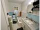 Charming bathroom with tiled floors, a vintage bathtub, and a sink with carrara marble countertops at 2120 8Th W Ave, Bradenton, FL 34205