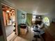 View of the living room with workout equipment, laundry machines, and window at 2120 8Th W Ave, Bradenton, FL 34205