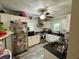 Well-equipped kitchen with stainless steel appliances, black countertops, and white cabinets at 2120 8Th W Ave, Bradenton, FL 34205