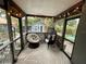 Screened in porch with outdoor seating and string lights at 2120 8Th W Ave, Bradenton, FL 34205