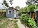 Exterior view of a charming shed with red roof and blue siding at 2120 8Th W Ave, Bradenton, FL 34205
