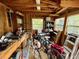 Interior view of storage shed with workbench, tools, windows, and shelves at 2120 8Th W Ave, Bradenton, FL 34205