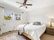 A bright bedroom featuring neutral paint, a ceiling fan, and a large window with natural light at 2155 Wood St # B18, Sarasota, FL 34237