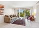 Cozy living area with comfortable seating and a view of the screened lanai at 2155 Wood St # B18, Sarasota, FL 34237