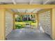 A covered patio is furnished with a table and seating at 2155 Wood St # B18, Sarasota, FL 34237