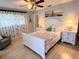 Inviting bedroom showcases a bed flanked by nightstands, soft lighting, and stylish decor at 240 Patterson Ave, Osprey, FL 34229