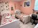 Comfortable bedroom with twin beds, a desk, and peach-themed bedspreads at 240 Patterson Ave, Osprey, FL 34229