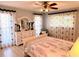 Cozy bedroom features natural light and charming decor for a relaxing retreat at 240 Patterson Ave, Osprey, FL 34229