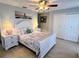 Comfortable bedroom featuring a bed with end tables and double door closet at 240 Patterson Ave, Osprey, FL 34229
