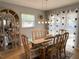 The dining area features large windows and stylish decor at 240 Patterson Ave, Osprey, FL 34229