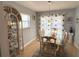 The dining room features large windows and a glass table, perfect for entertaining at 240 Patterson Ave, Osprey, FL 34229
