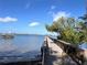 Picturesque dock extending into the water, offering a serene waterfront view on a sunny day at 240 Patterson Ave, Osprey, FL 34229