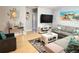 Bright living room with a large sectional, stylish decor, and ample natural light at 240 Patterson Ave, Osprey, FL 34229