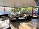 Screened porch with cozy seating, ideal for relaxation and outdoor enjoyment at 240 Patterson Ave, Osprey, FL 34229