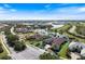 Expansive aerial view of a waterfront property with lush surroundings and community amenities at 26725 Raphis Royale Blvd, Englewood, FL 34223