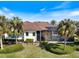 Aerial view showcases a landscaped backyard and screened-in pool perfect for relaxation and entertaining at 26725 Raphis Royale Blvd, Englewood, FL 34223