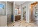 The bathroom features a walk-in shower, vanity, and a separate toilet room at 26725 Raphis Royale Blvd, Englewood, FL 34223