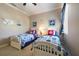 Bright bedroom with two twin beds boasts nautical decor, cozy bedding, and a calming atmosphere at 26725 Raphis Royale Blvd, Englewood, FL 34223
