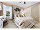 This comfortable bedroom features a queen-size bed and a ceiling fan at 26725 Raphis Royale Blvd, Englewood, FL 34223