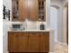 Classic butlers pantry featuring plenty of cabinets and counterspace at 26725 Raphis Royale Blvd, Englewood, FL 34223
