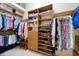 This walk-in closet offers plenty of storage space for clothing and accessories at 26725 Raphis Royale Blvd, Englewood, FL 34223