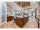 Open concept living spaces with an expansive kitchen island and breakfast area and living room at 26725 Raphis Royale Blvd, Englewood, FL 34223