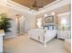 This spacious main bedroom features a trey ceiling, neutral paint, white trim, and carpeted floors at 26725 Raphis Royale Blvd, Englewood, FL 34223
