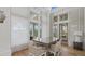 Elegant dining area with a glass table, comfortable chairs, and lots of natural light at 2818 Starwood Ct, Lakewood Ranch, FL 34211